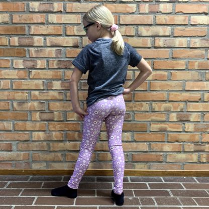 SIPPA lila barnleggings med gula blommor